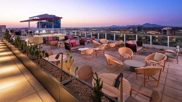 Planned rooftop meetup at Skysill Rooftop Lounge sets the tone for an elevated night out.